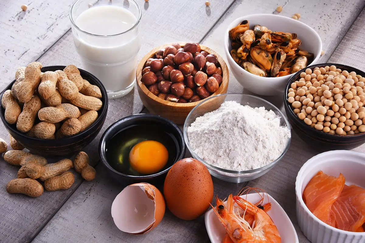several bowls of common allergic foods