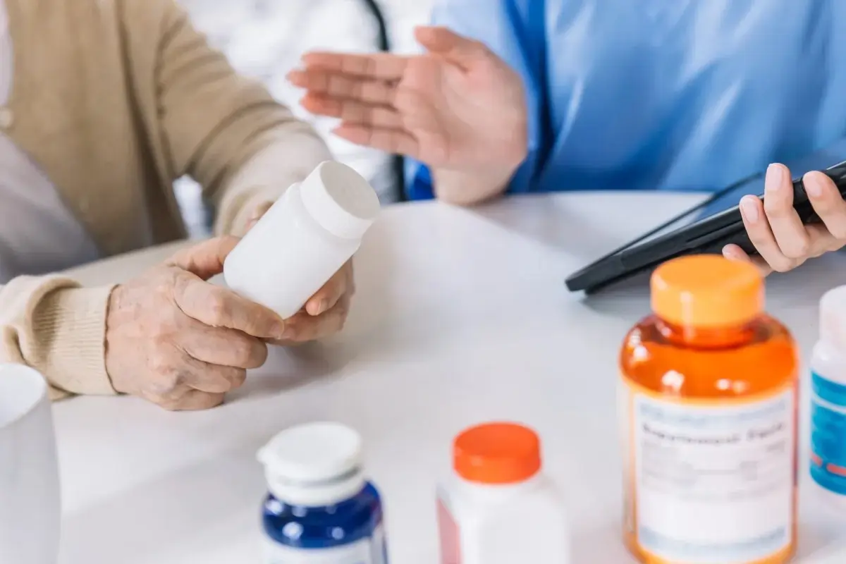 a pharmacist advising a patient
